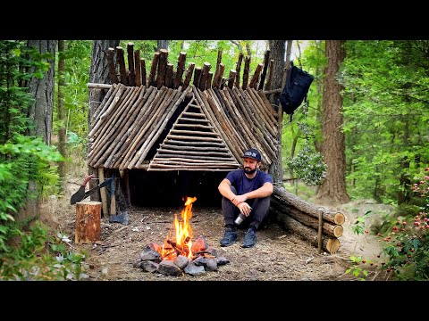 Building a Small temporary Shelter between two trees in the