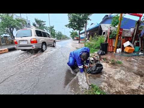 Remove the leaves and debris clogging the drain, then let