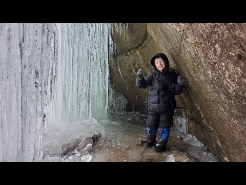 Winter Camping Under Frozen Waterfall in Survival Shelter