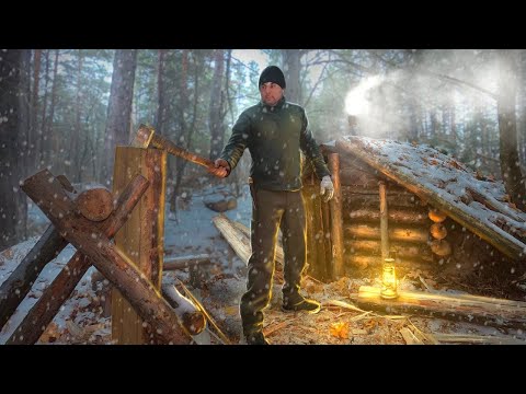 Solo bushcraft in a dugout, planks of logs, work in the