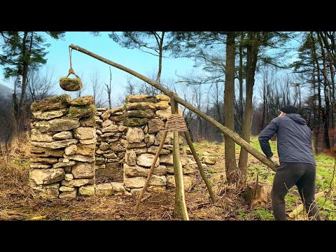 Building a Hut from stones using an ancient crane Shelter
