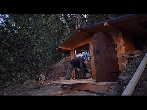 A dugout in the mountains to watch the rain, Built a