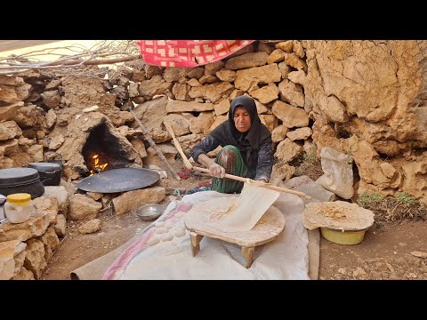 Iran nomadic life baking traditional bread in a mountain
