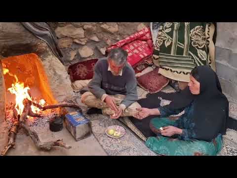 Iran Nomadic life Planting a tree on a rainy day in the