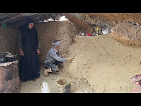 Building a shelter wall with natural materials for survival
