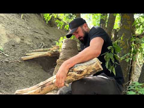 Building a primitive survival shelter escaping from a wild