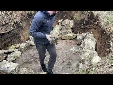 Building a secret shelter dugout made of stones
