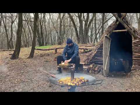 Hut in the forest Outdoor Cooking Cooked fried meat for