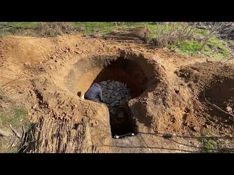 Building of a secret dugout forest bunker for survival