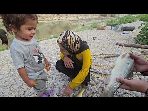 Nomadic Family Living on a River Island Fishing Swimming