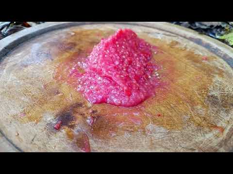 Sheep food in a special dish Gamaj Cooking in nature in a