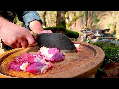 Kebab jar in a special clay pot Forest broth on fire