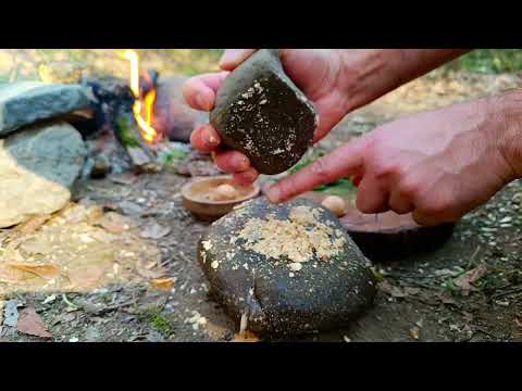 Bushcraft and grilling fish on a wooden net Making a wooden