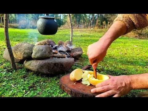 Charred potatoes stuffed with eggs Red skin tent in nature