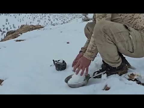 Snow is falling on a Frozen Mountain Surviving the Night in