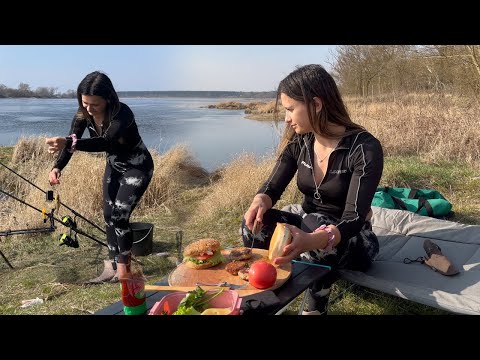 Girl is Fishing Alone on the River Cooking Relaxing with