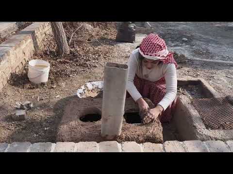 Building a traditional stove and cooking local food over an