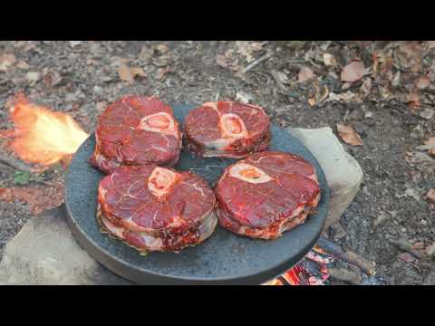 Whiskey Flamed Osso Buco Beef Steaks on Hot Rock Outdoors