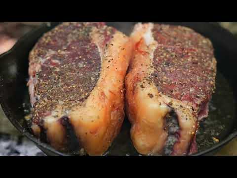 Cooking a Juicy Steak Sandwich Over Open Fire