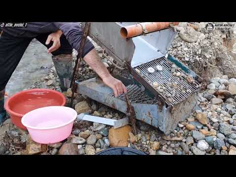 Prospecting For Gold In The River With a Sluice Machine