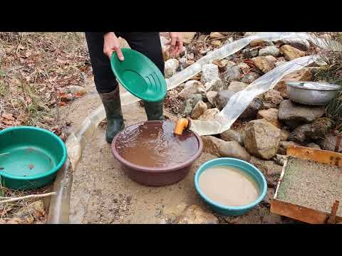 The process of extracting gold from rivers and streams