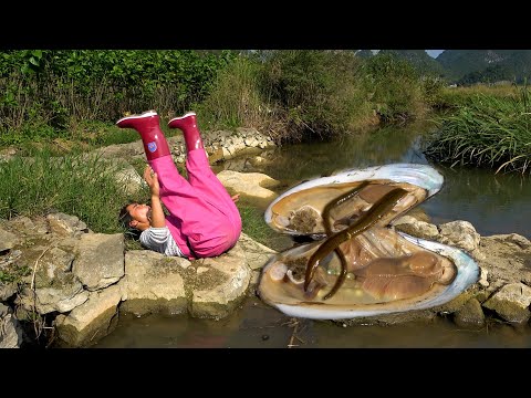 The beautiful woman opened the clam and shouted it was