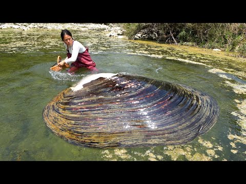 The beautiful woman stirred the river water and there was a