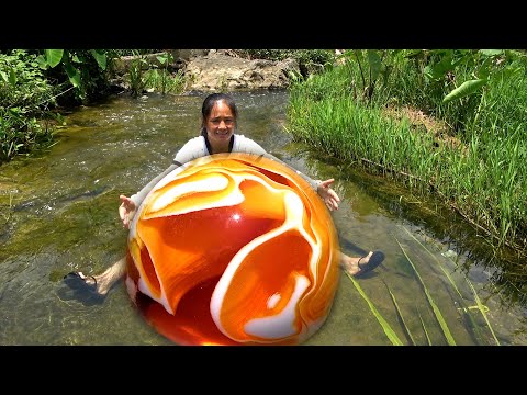 The beauty takes out a big baby from a clam beautiful to