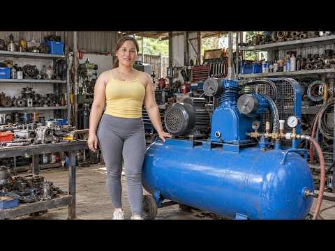 A beautiful genius girl repairs a broken air compressor and