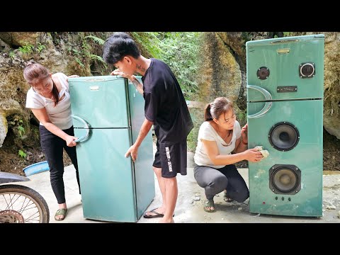The girl helped the young man make a speaker with two huge