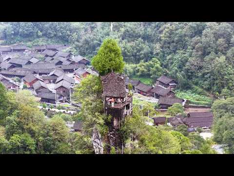 湖南深山绝壁上发现一座奇特房屋 一位老人在此隐居三十多年 只为让世人看到心中的世外桃源 Strange houses