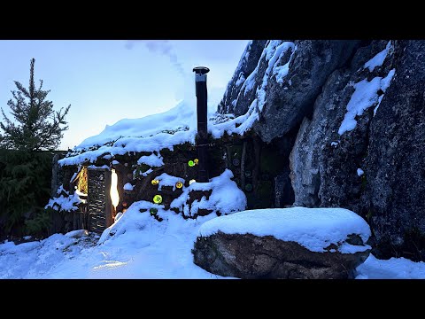 making a shelter next to a rock in the wild staying and