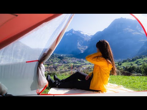 Camping in Snow mountain and green meadow had a relaxing