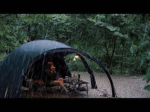 Camping in heavy rain in the forest where rain like water