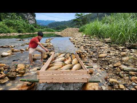 The boy handcrafted a unique fish trap from wooden planks