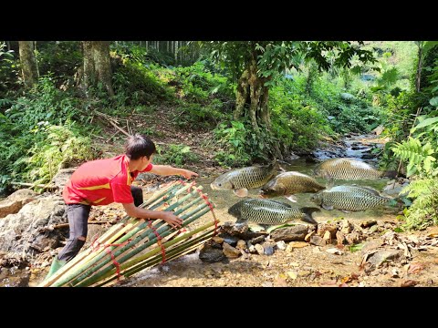 The boy wove bamboo to make a trap to catch fish in the