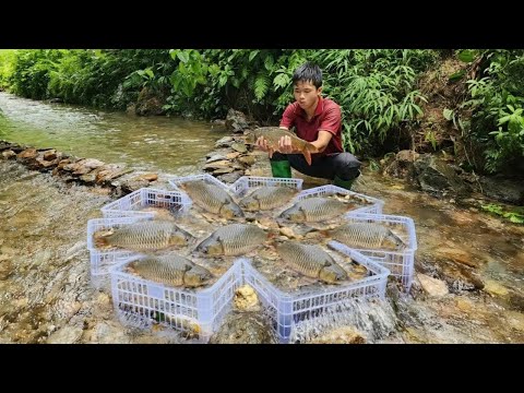 The boy used white plastic baskets to make fish traps in