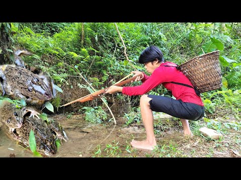 The boy used a crossbow to hunt frogs in the stream Lucky