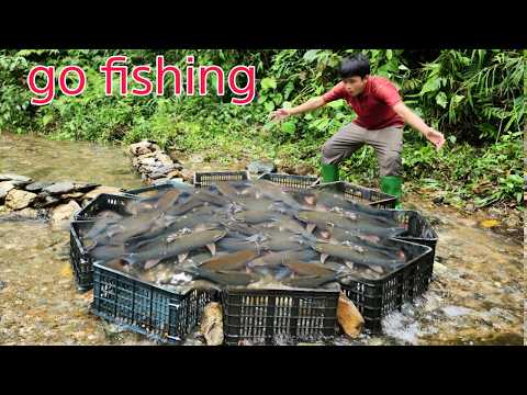 Using plastic containers to fish in the stream Lam caught a