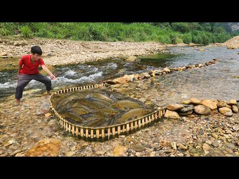 The skillful boy Lam made his own bamboo traps by the