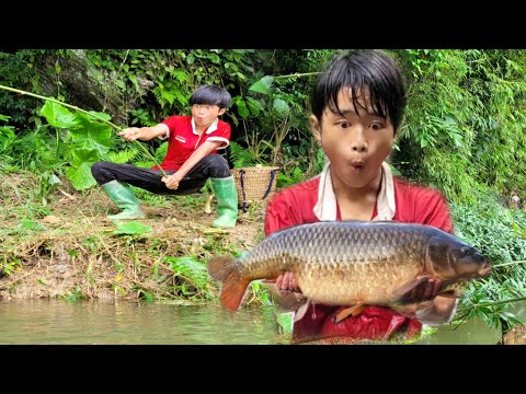 The guy caught a giant carp in a big stream wandering boy