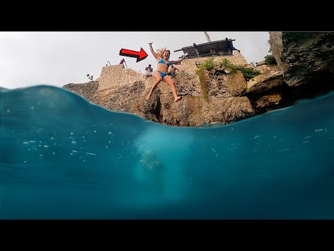 Cliff Jumping into the Ocean Snorkeling Clear Reef Waters