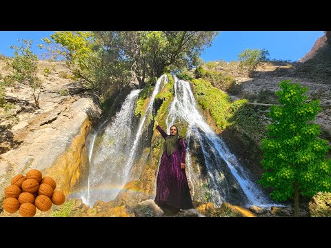 Nomadic woman on the walnut tree stunning scenery