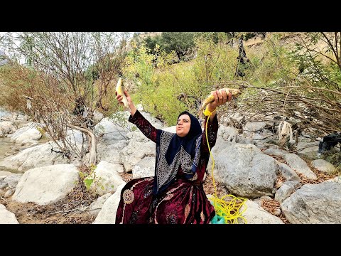 Fishing in the heart of nature a nomadic woman and a raging