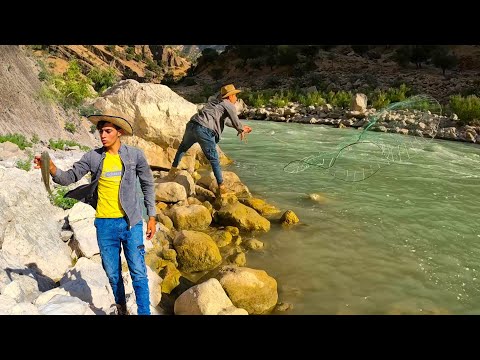 Fishing by a nomadic boy for his younger brother