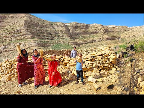 A nomadic family builds a pen for their sheeps in the