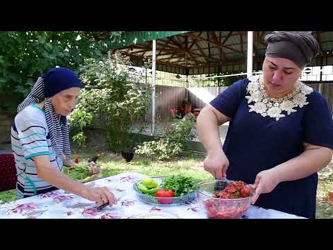 COOKING TURKISH PIZZA LAHMACUN WITH FRESH VEGETABLES FROM