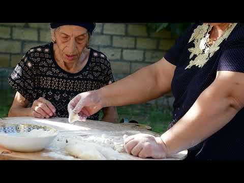Cooking Delicious Dish Surhullu Made of Dough and Meat