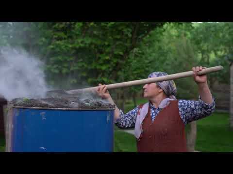 Making Barbecue Charcoal in Iron Barrels and Cooking Lamb