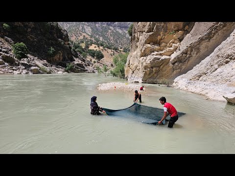 Washing Blankets in Dangerous River Iranian Nomads
